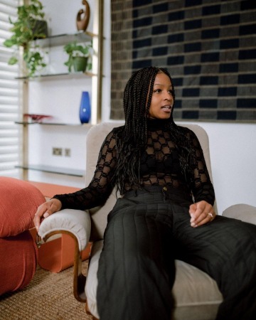 Julie Adenuga is posing for the photo.